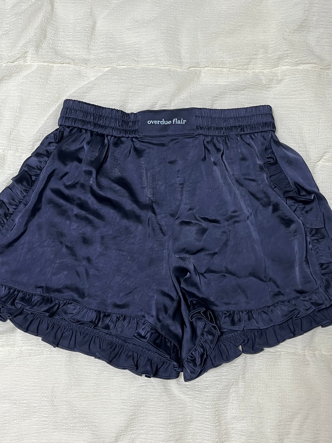 오버듀플레어 프릴 새틴 쇼츠_네이비 상품이미지1
