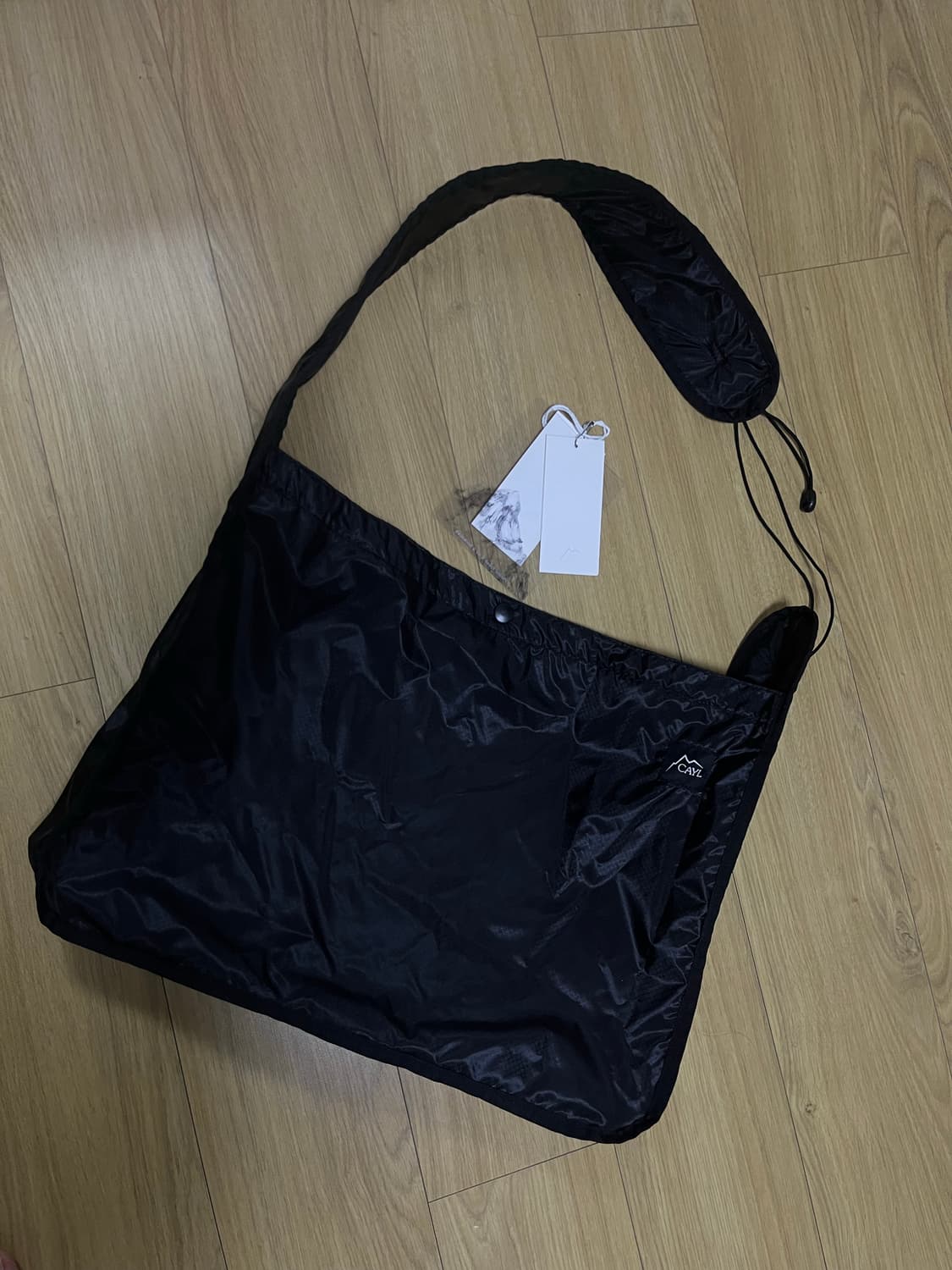 cayl 케일 라이트 패커블 크로스백 블랙 상품이미지1