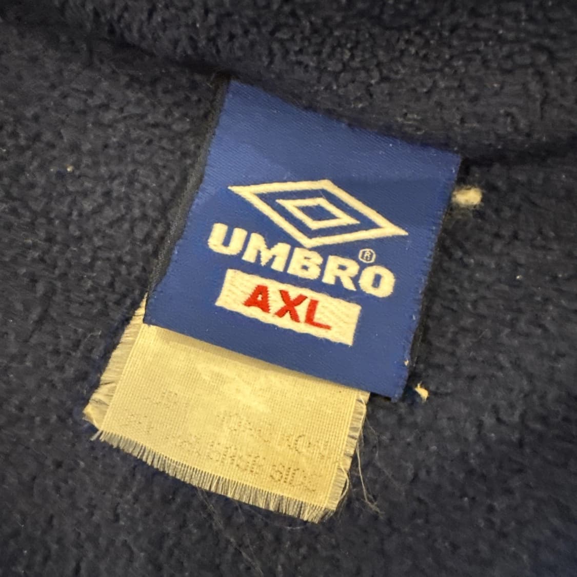  엄브로 크리스피 타슬란 카라 하프 집업  상품이미지5