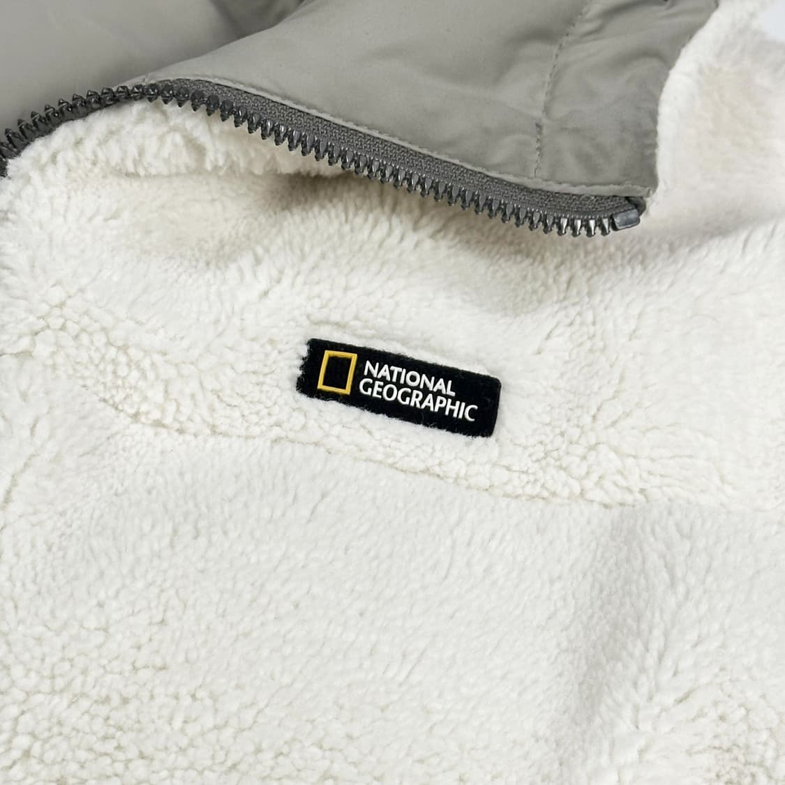 내셔널지오그래픽 뽀글이 와펜 리버시블 패딩 M 상품이미지3