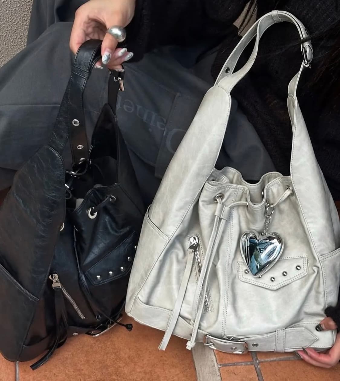 DEINET STUD BELTED BUCKET BAG IN ASH BEI 상품이미지1