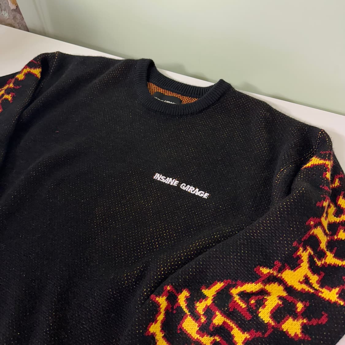 OS 인세인개러지 루즈오버핏 블랙 암로고 울 라운드니트 상품이미지1