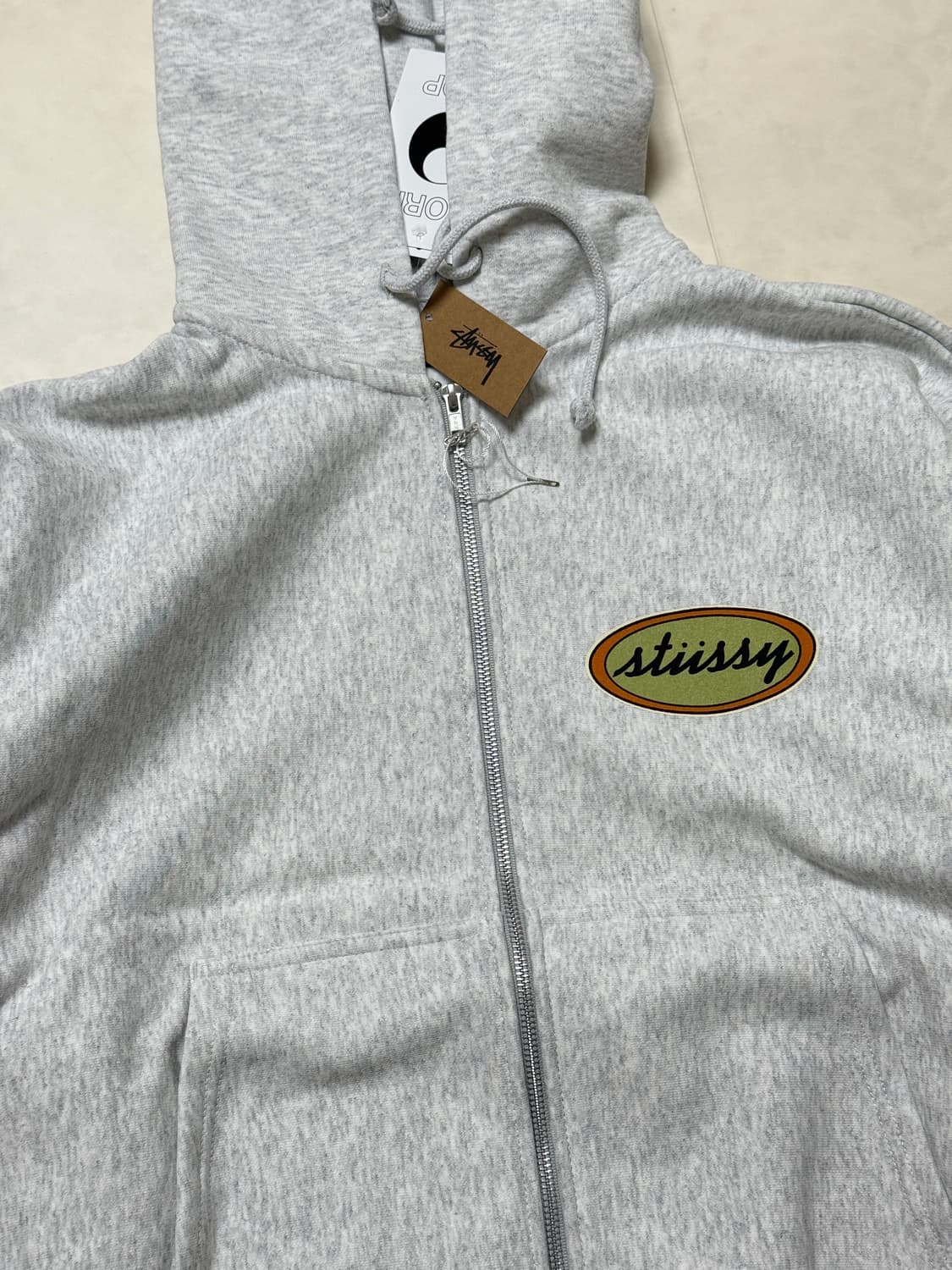 스투시 아워레가시 워크샵 오발 집 후디 애쉬 헤더 상품이미지2