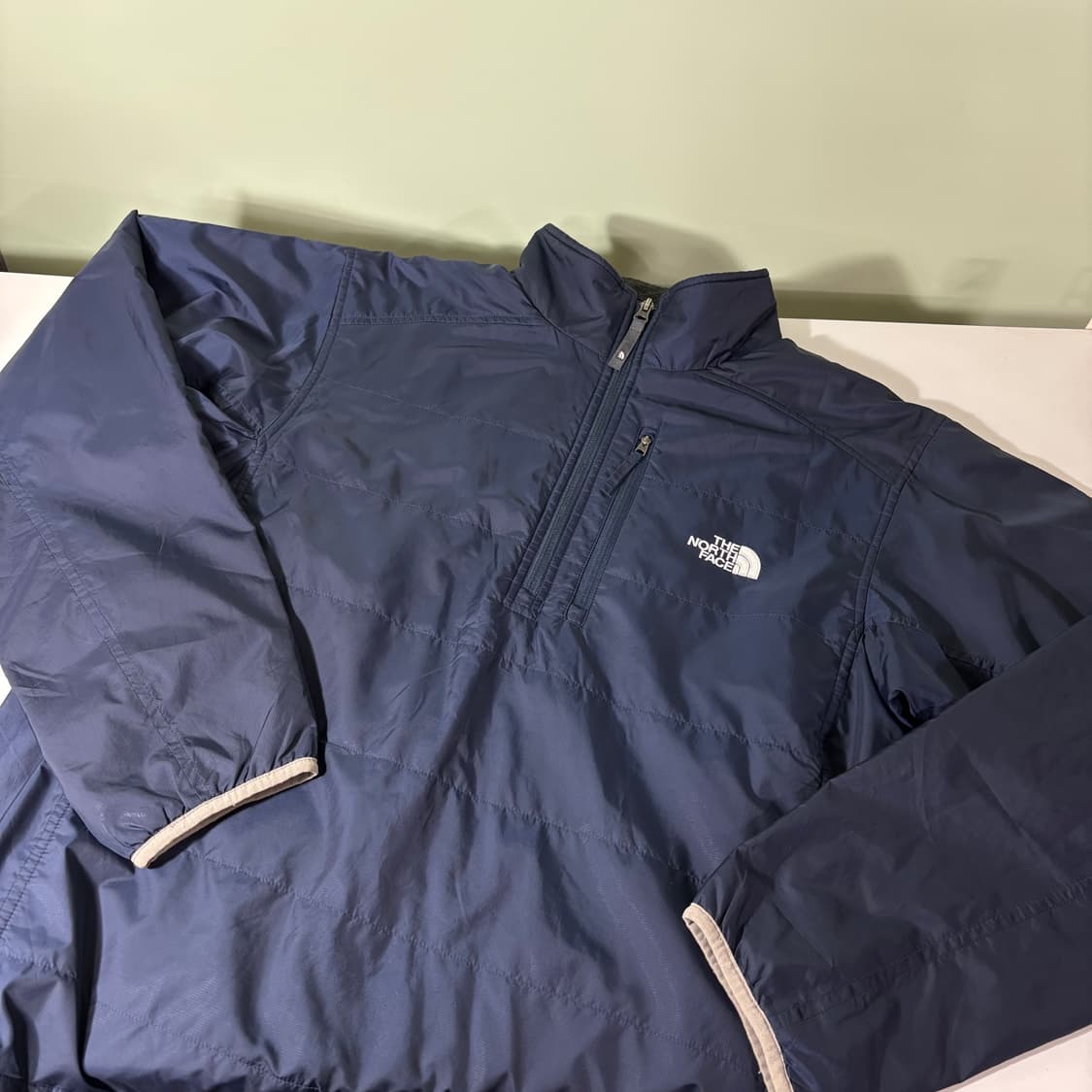L 노스페이스 네이비 기본로고 반집업웜업 바람막이 상품이미지1