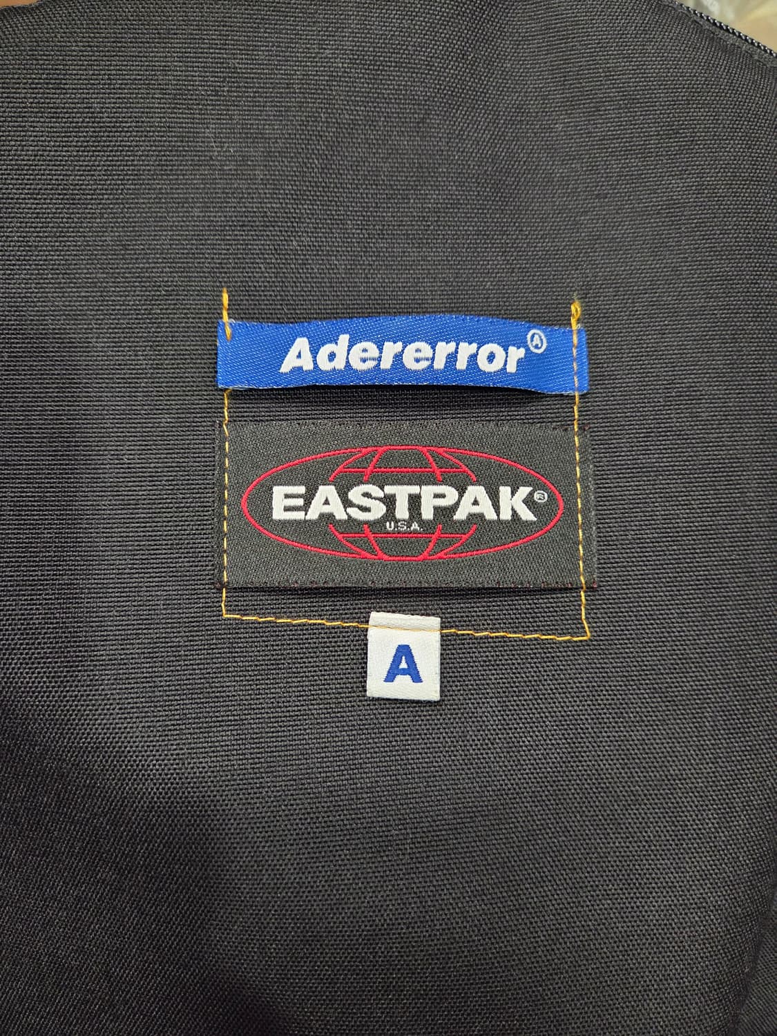 아더에러 x 이스트팩 패디드 백팩 블랙 상품이미지9