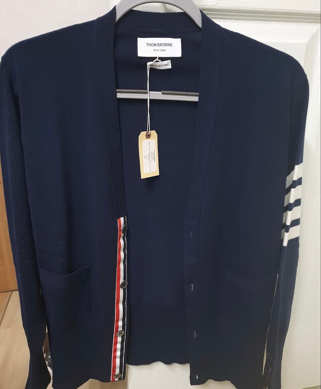 [5] 새상품  톰브라운 캐시미어 사선 가디건 네이비 상품이미지1