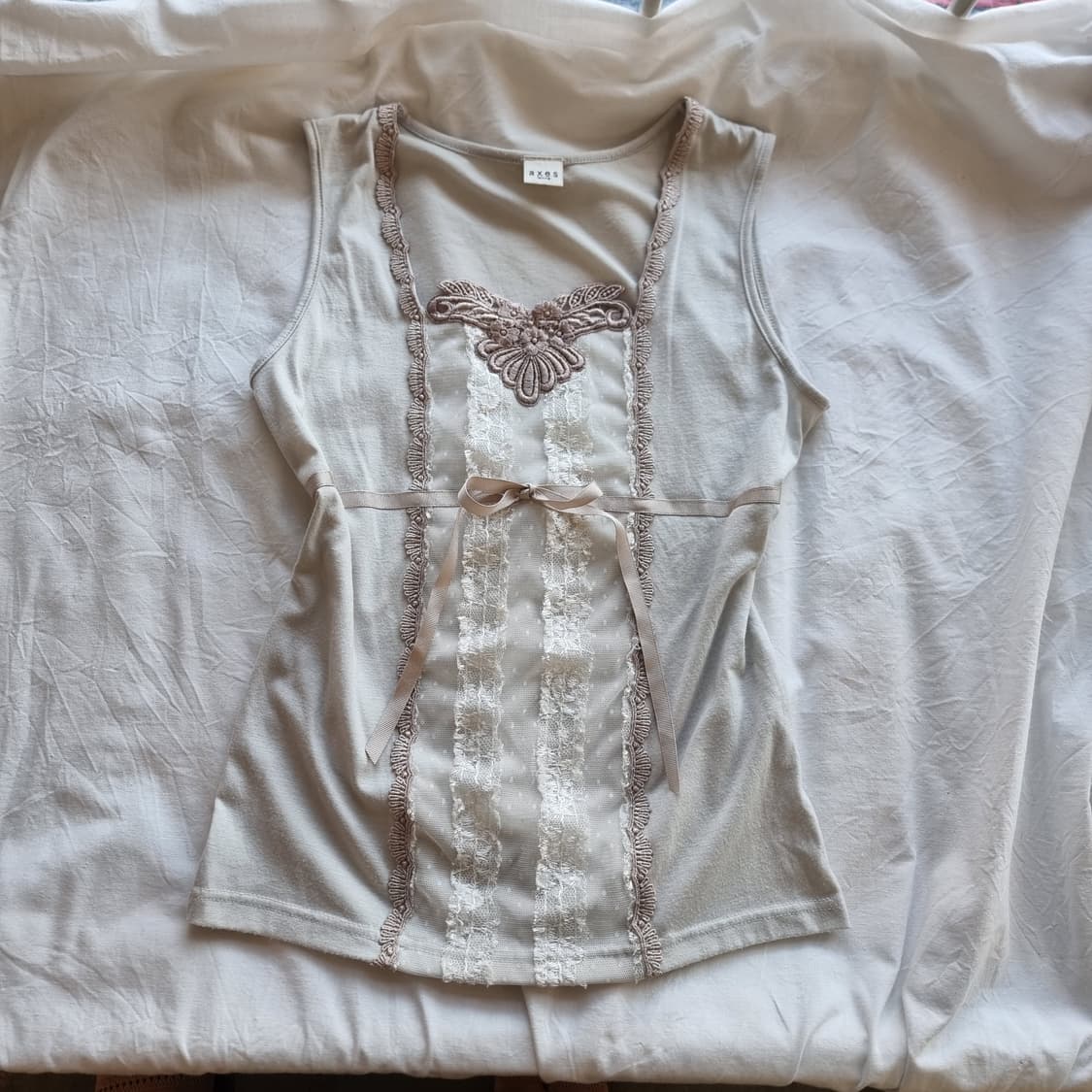 레이스 핀턱 리본 슬리브리스 탑 상품이미지1