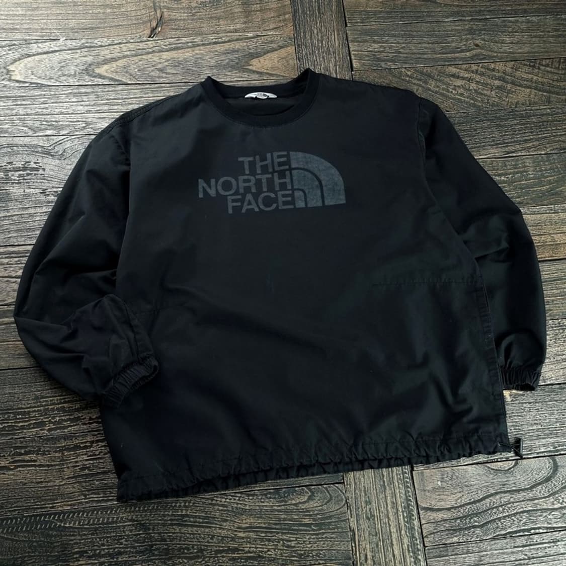 [노스페이스] 빅로고 오버핏 바람막이 웜업 블랙 M18031 상품이미지1