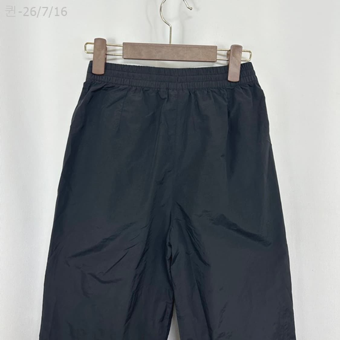 뉴발란스 여자 나일론 조거 밴딩바지 검정 70 (S) 상품이미지7