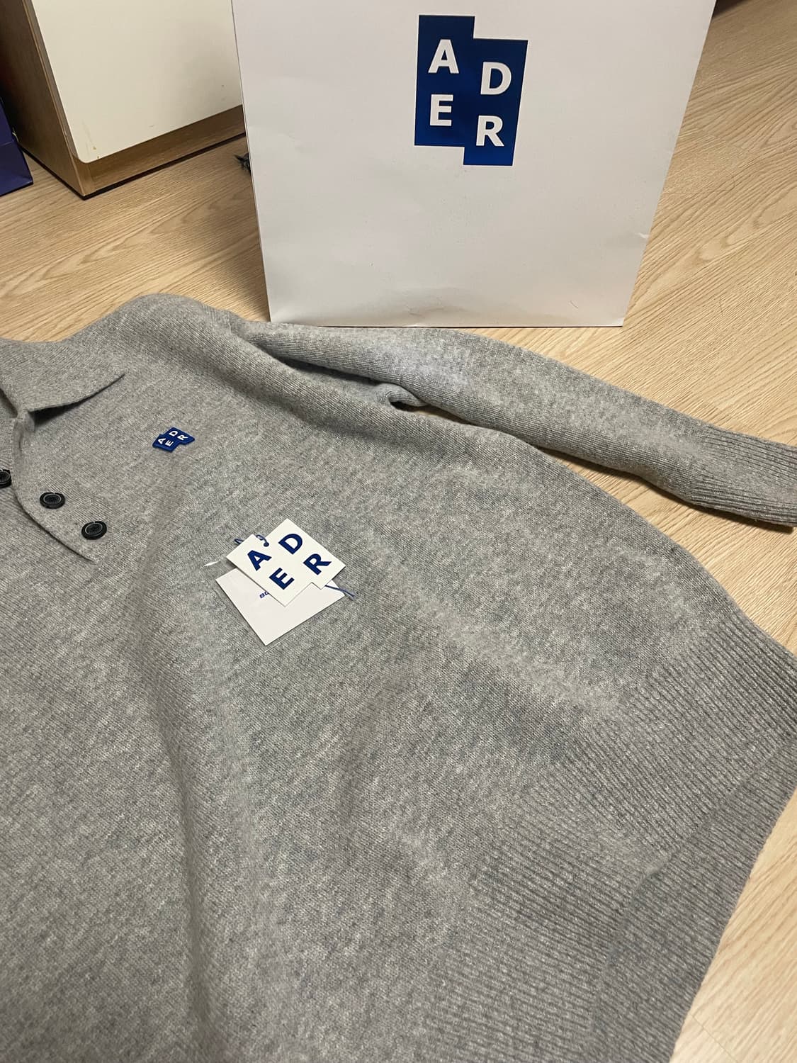 아더에러 버튼 폴로 셔츠 상품이미지1