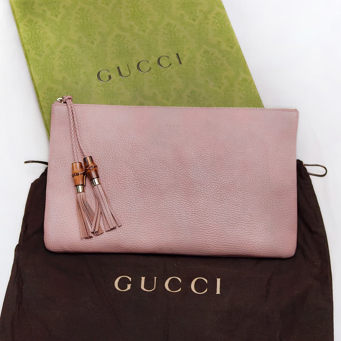 구찌 (GUCCI) 뱀부 테슬 페일핑크 토고가죽 클러치백 상품이미지1