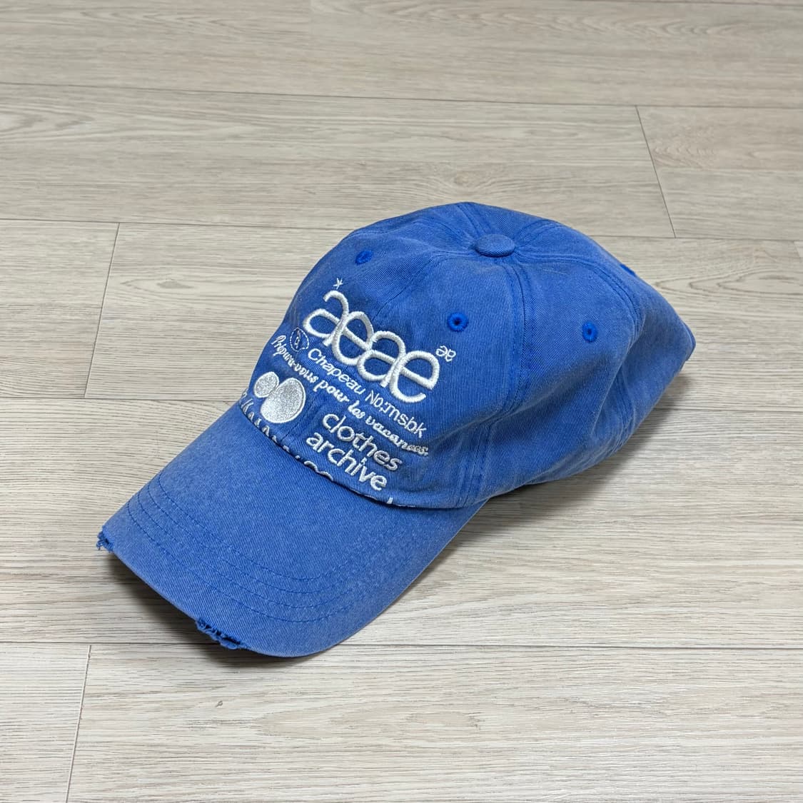 aeae 에이이에이이 웹 로고 데미지 볼캡 블루 상품이미지1