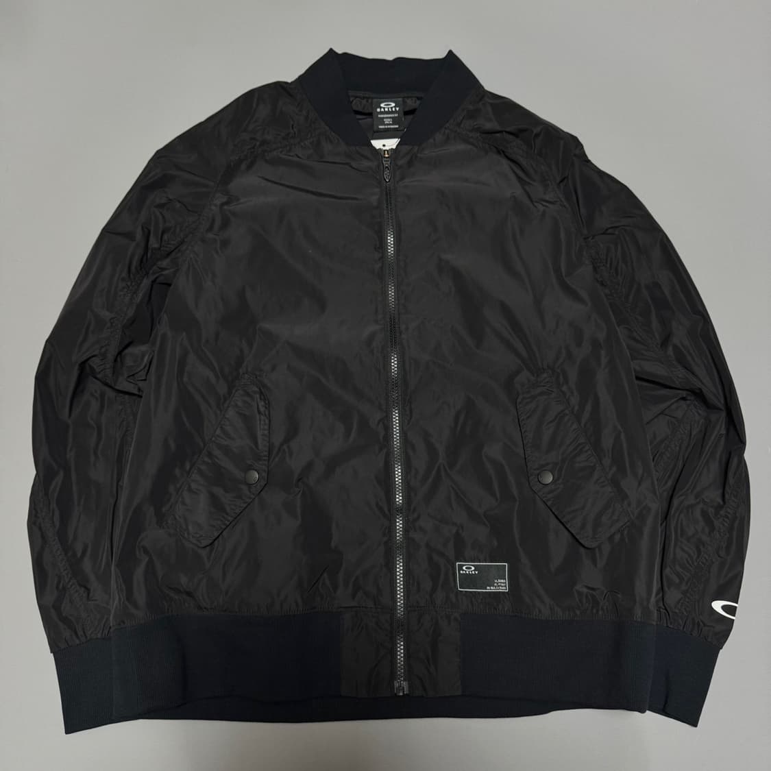 오클리(OAKLEY) 블랙컬러 폴리에스터 논칼라 쉘 윈드브레이커 상품이미지5