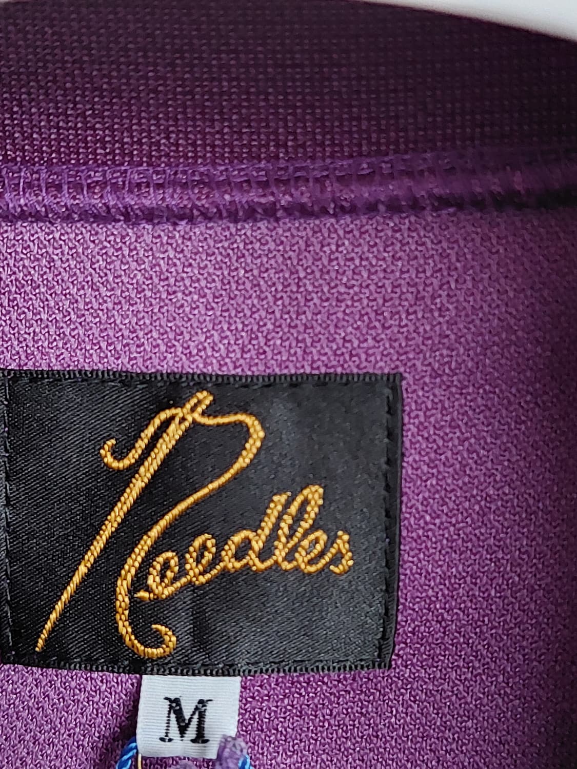 니들스 트랙자켓  폴리스무스 퍼플(M) 판매합니다. 상품이미지1