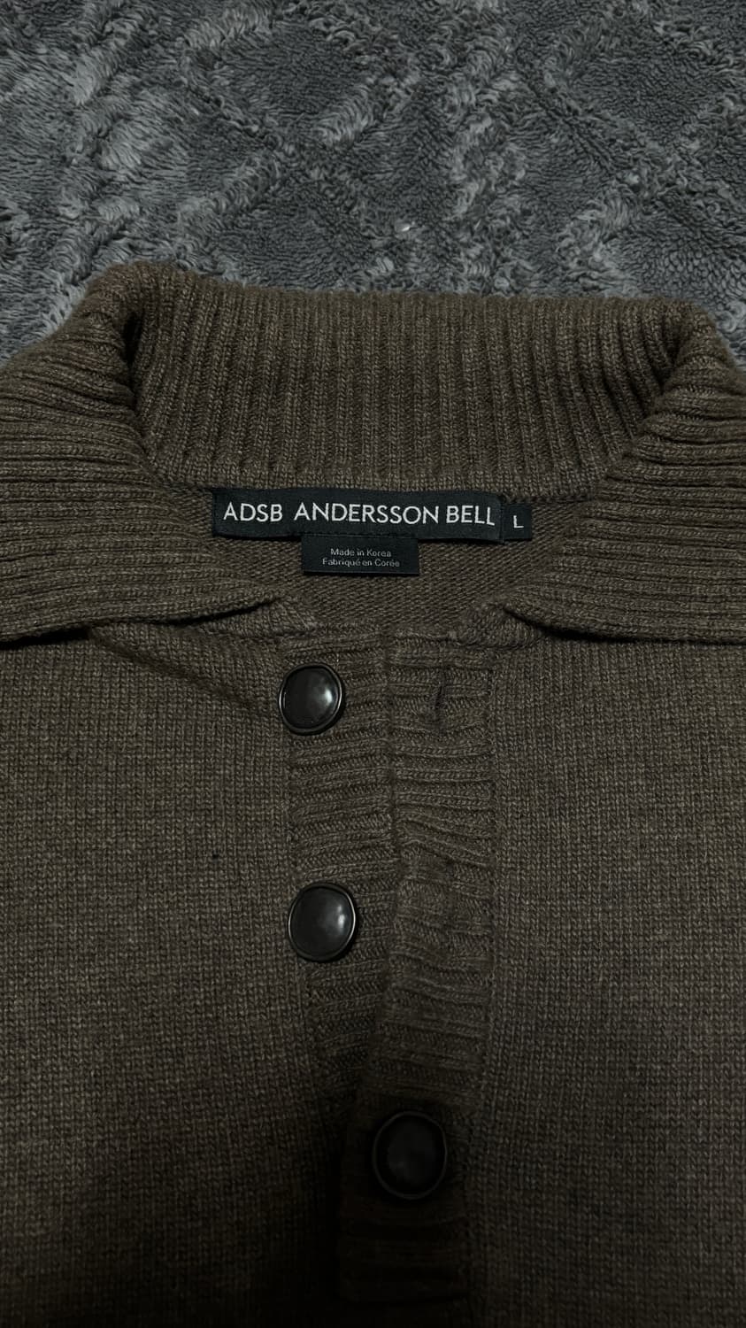 앤더슨벨 컷아웃 폴로 스웨터 상품이미지1