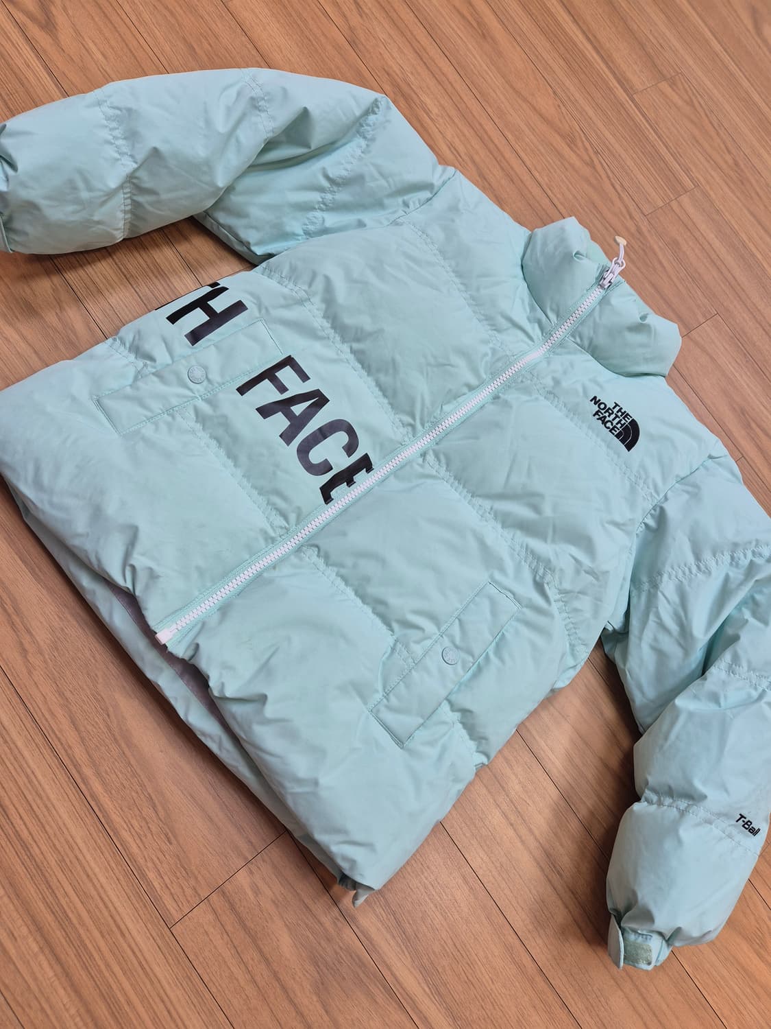 노스페이스 키즈 알칸 티볼 숏패딩 130사이즈입니다. 민트색상 숏패딩이라 상품이미지1