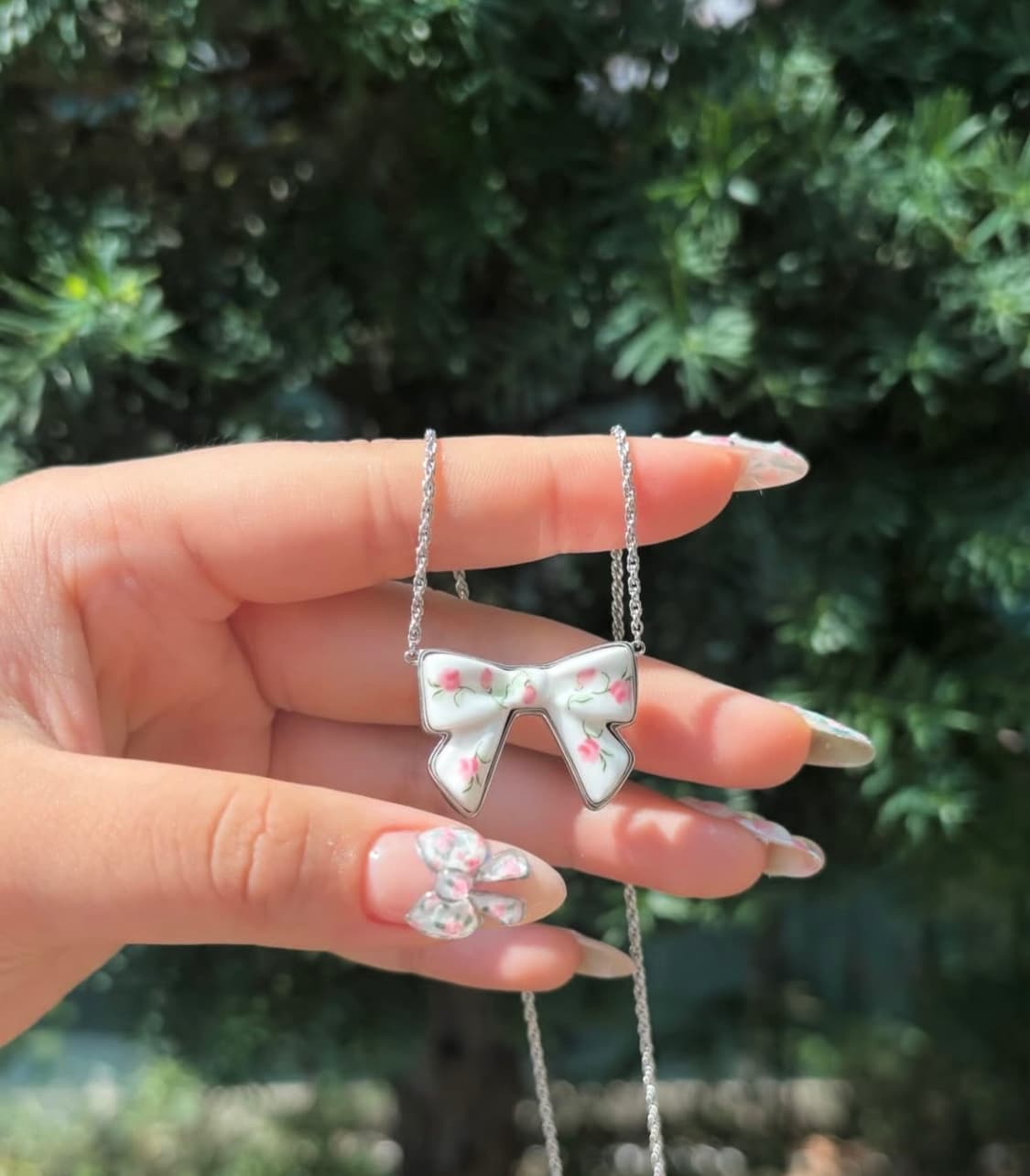 [ OS ] 슈슈통 위민 더블사이드 양면 리본 목걸이 실버 플라워 상품이미지1