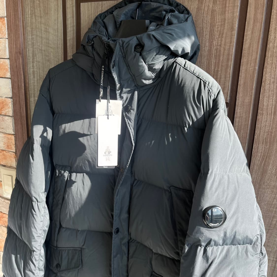 새상품(XXL)씨피컴퍼니 나이크라 후드 롱패딩 다크그레이 상품이미지1