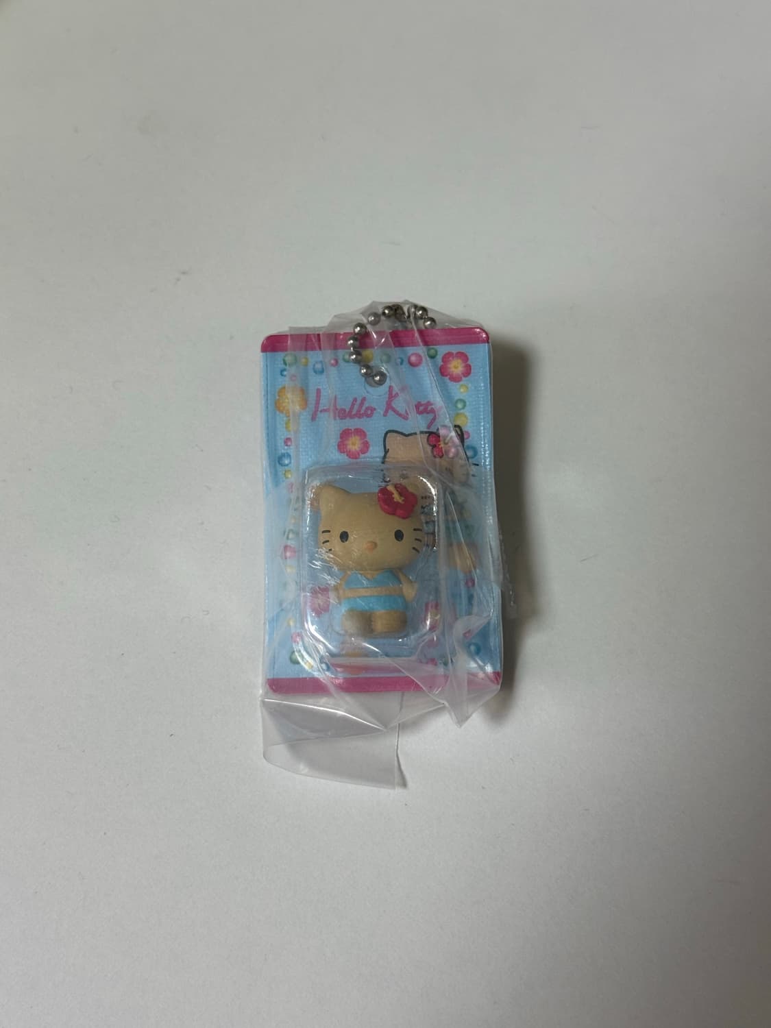 [새상품] 산리오 헬로키티 패키지 미니어처 가챠 태닝키티 상품이미지1