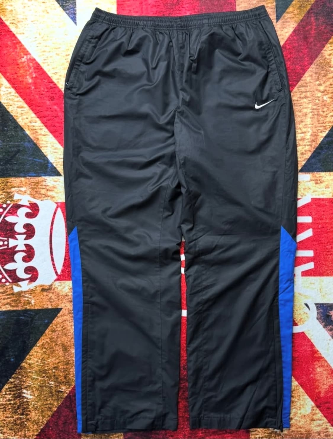 나이키 블랙스우시 지퍼 절개 트랙팬츠. 상품이미지1