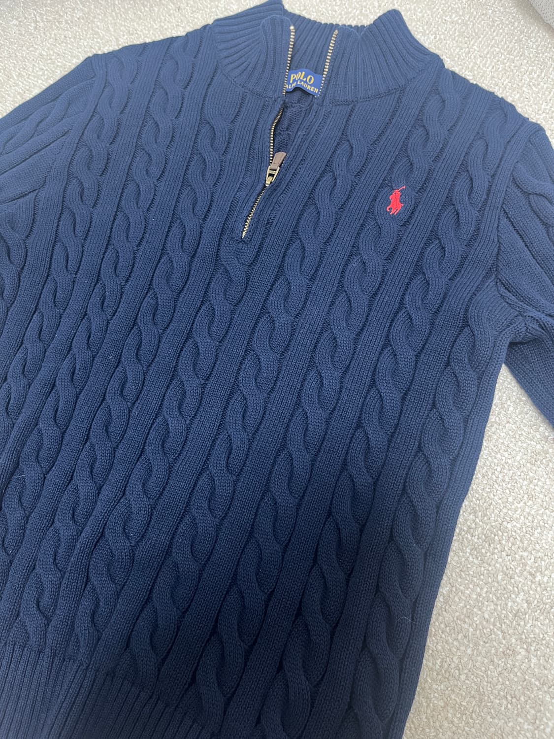 폴로 꽈배기 니트 반집업 상품이미지1