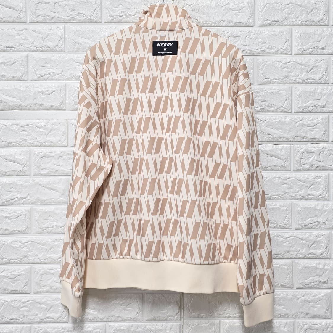 택포// 널디 심볼 패턴 트랙탑 L 크림 상품이미지4