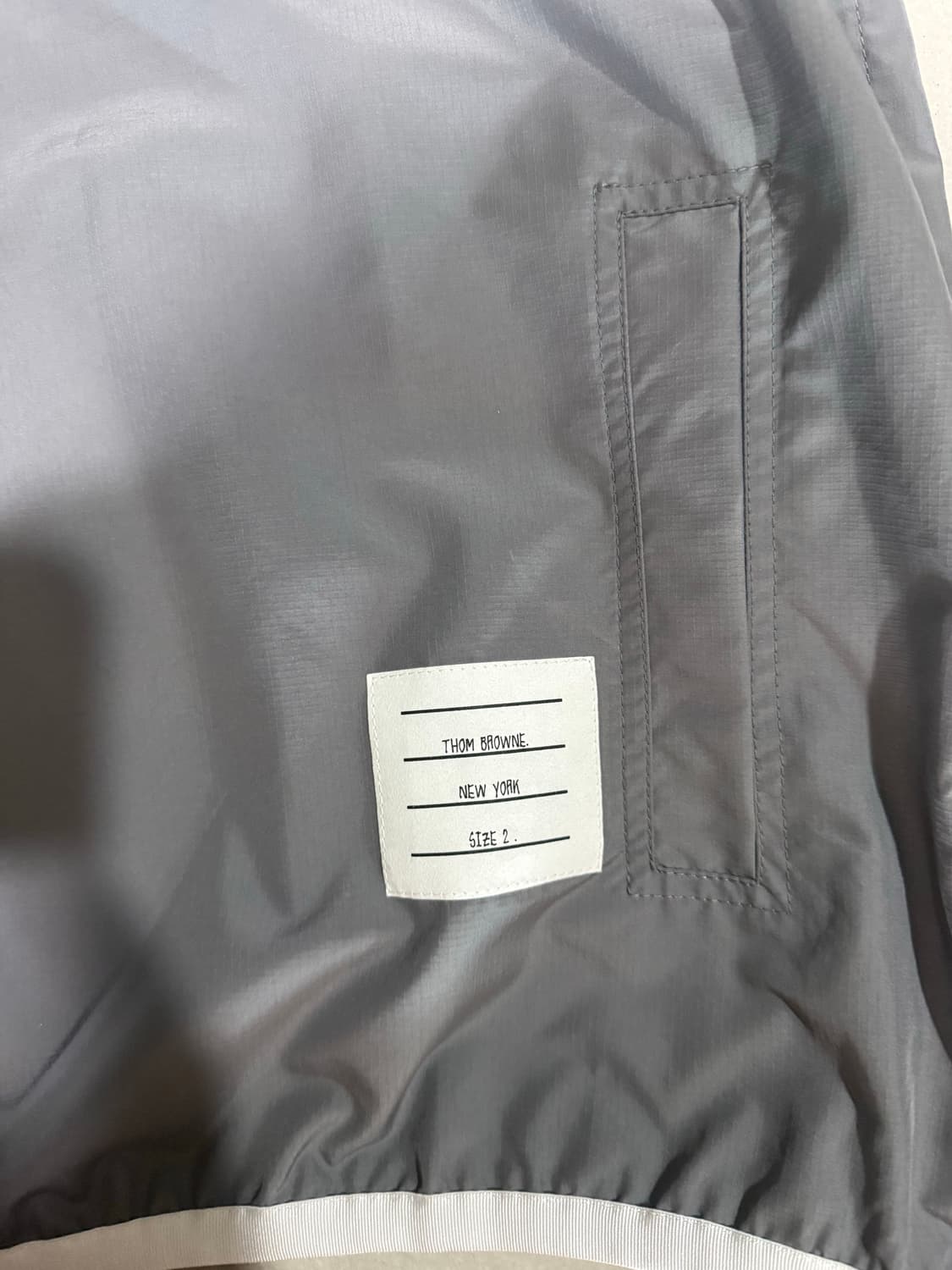 [당일출고,2사이즈] 새상품급 톰브라운 립스탑 바람막이 상품이미지5