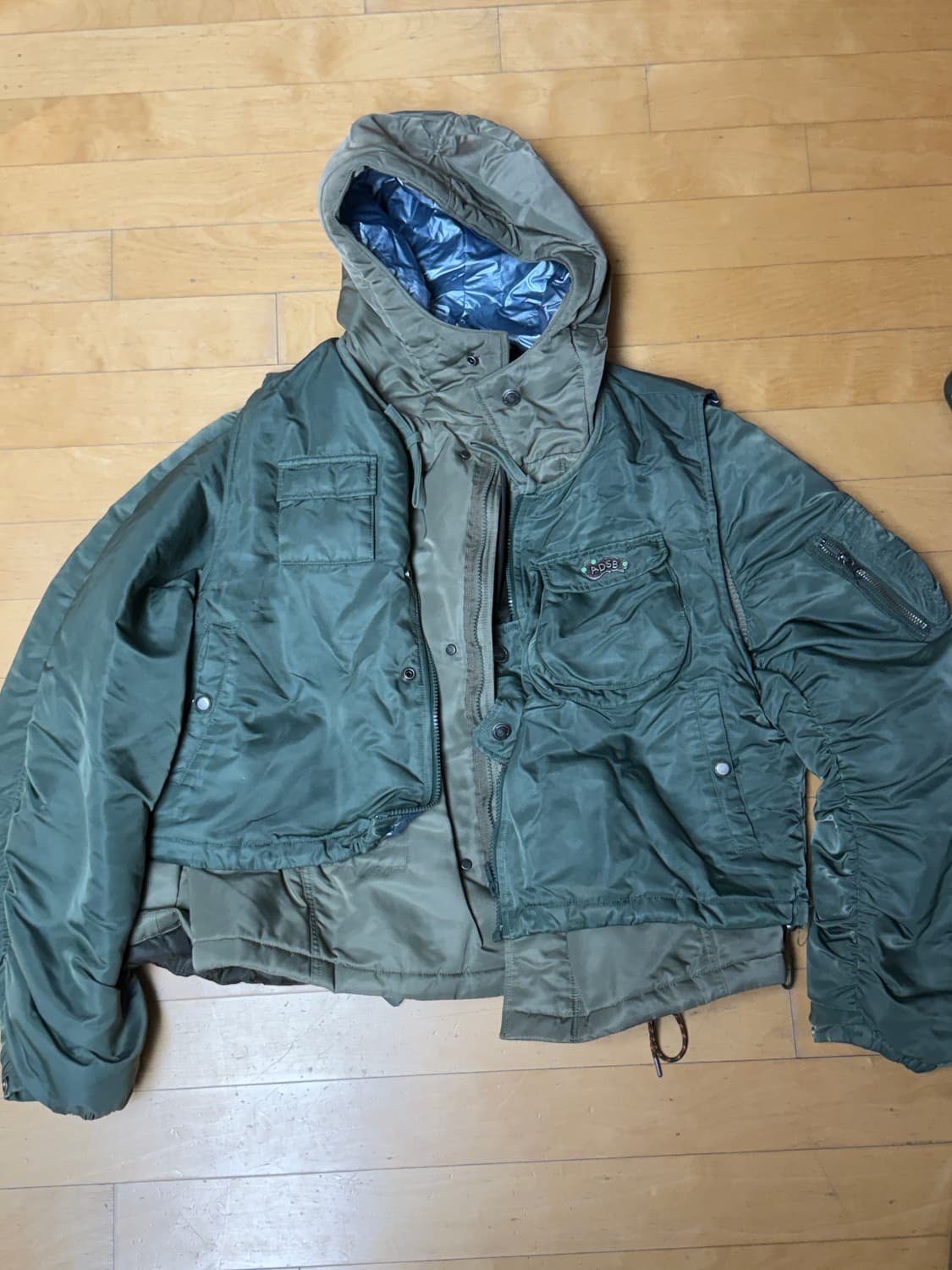 앤더슨벨 헤이든 베스트 패디드 레이어드 자켓 카키 상품이미지2