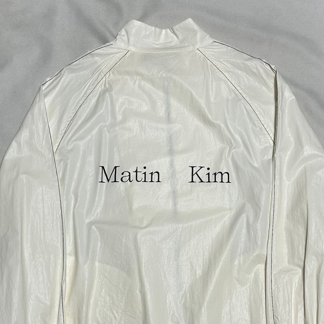 F 마뗑킴 로고 코팅 화이트 바람막이 상품이미지1