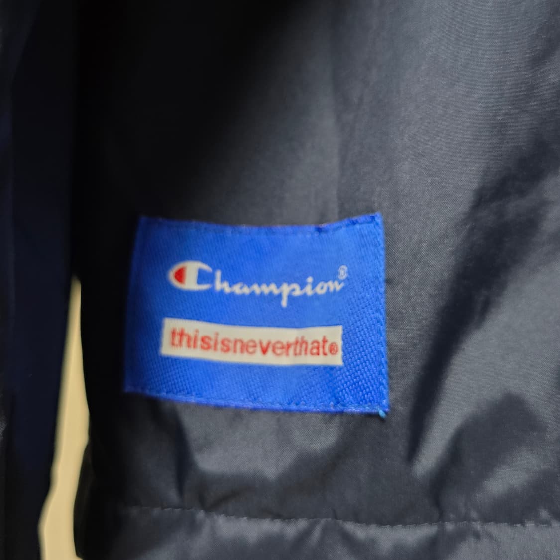 챔피언x디스이즈네버댓 코치자켓 상품이미지6