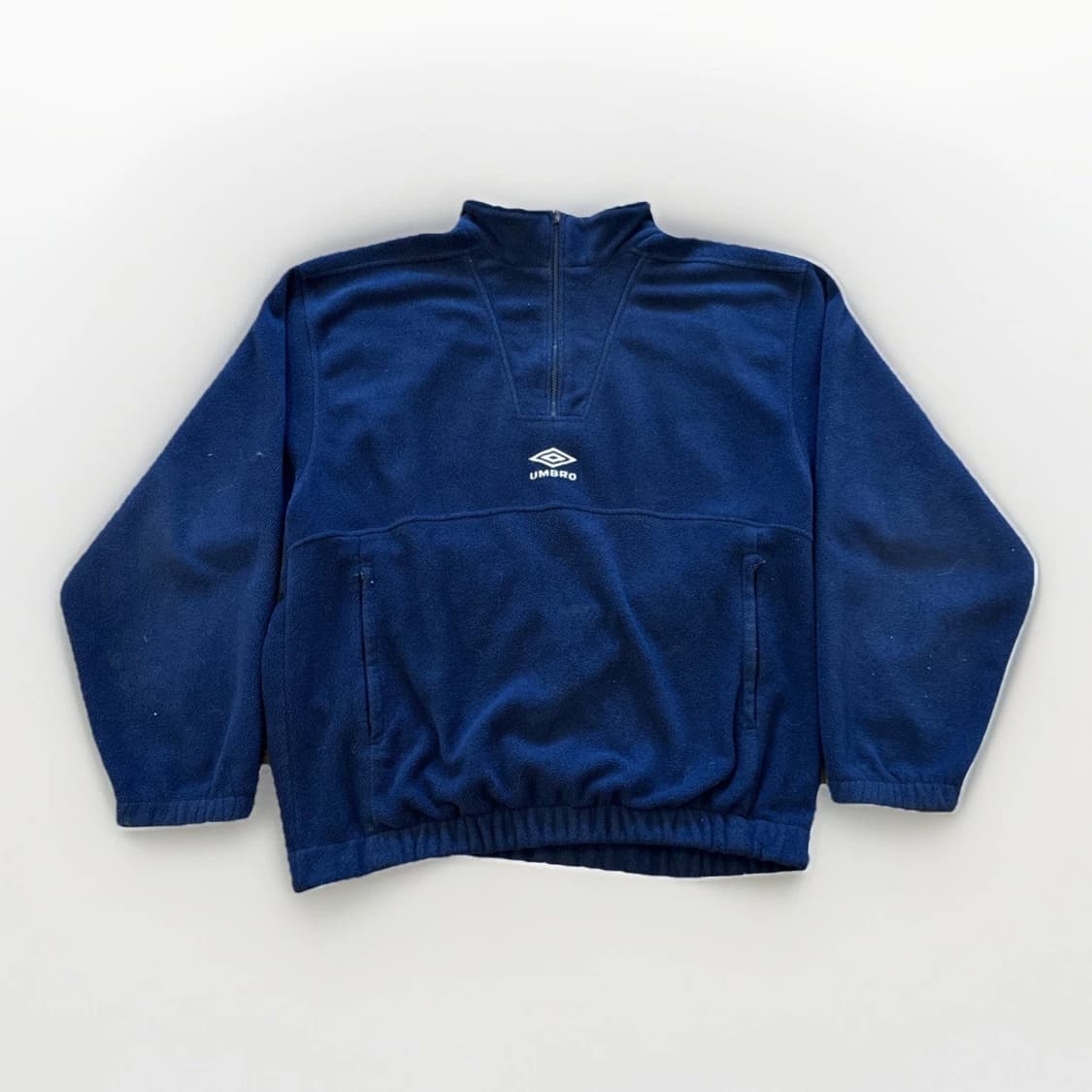  엄브로 크리스피 타슬란 카라 하프 집업  상품이미지1