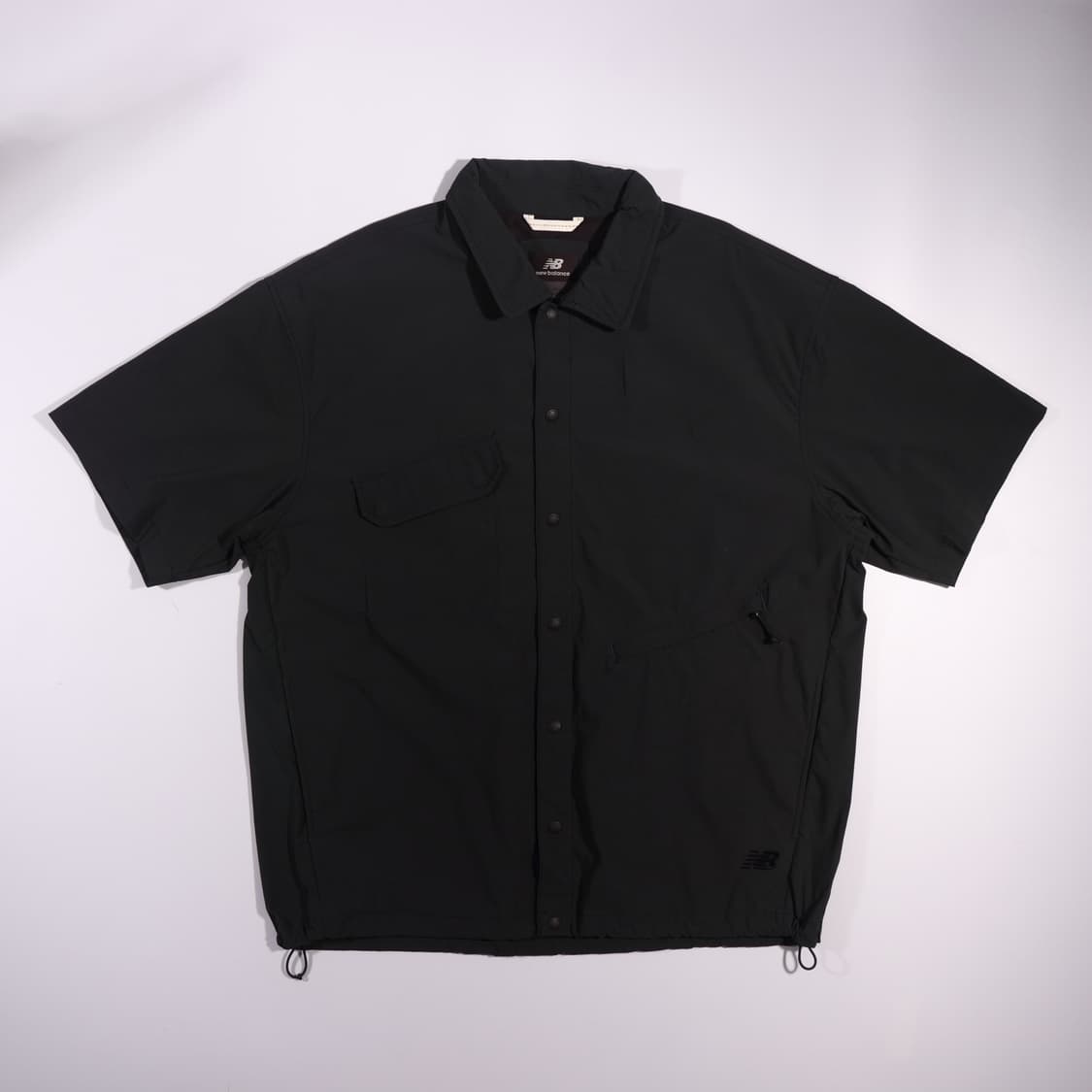 뉴발란스 버튼 반팔 바람막이 자켓 B600 상품이미지1