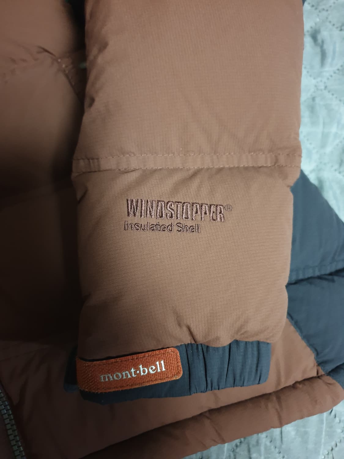 몽벨 폭스퍼 구스다운 윈드스토퍼 필800 패딩 브라운 (100) 상품이미지3