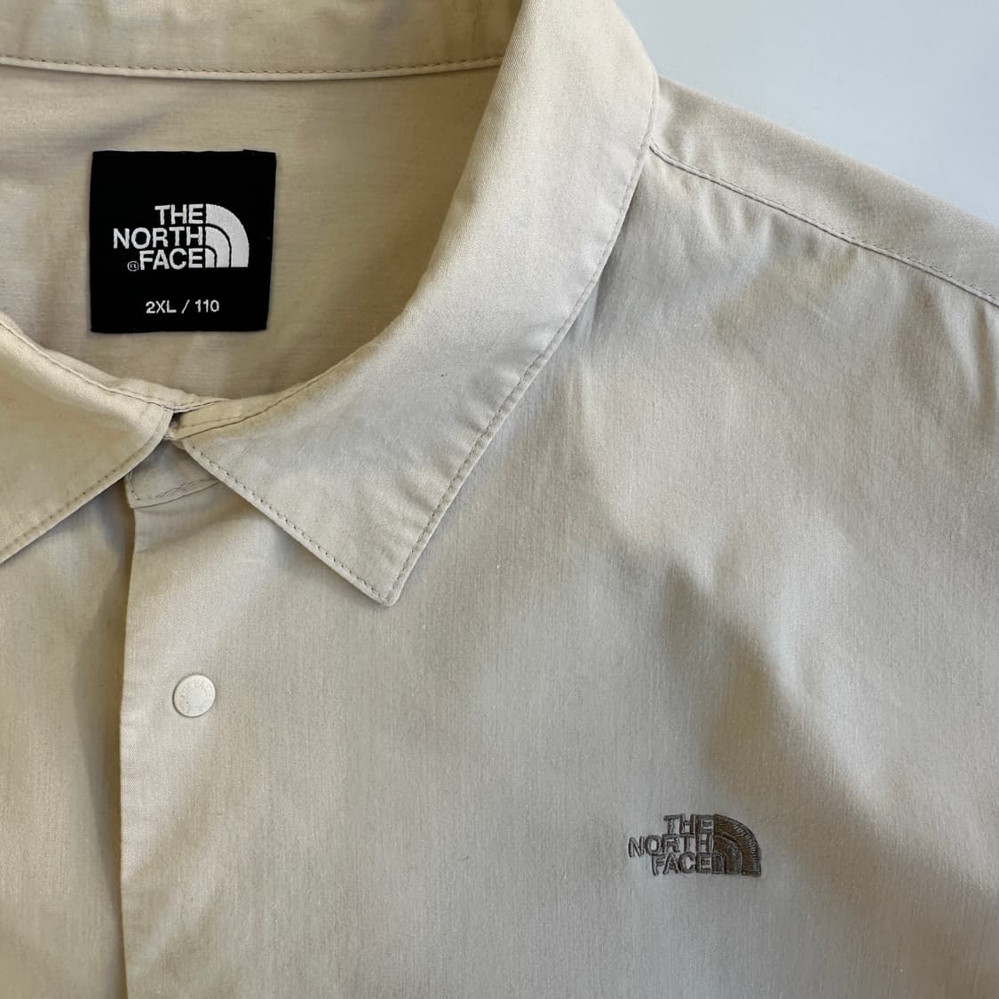 노스페이스 브라운베이지 나나미키 로고 버튼 셔츠 상품이미지1