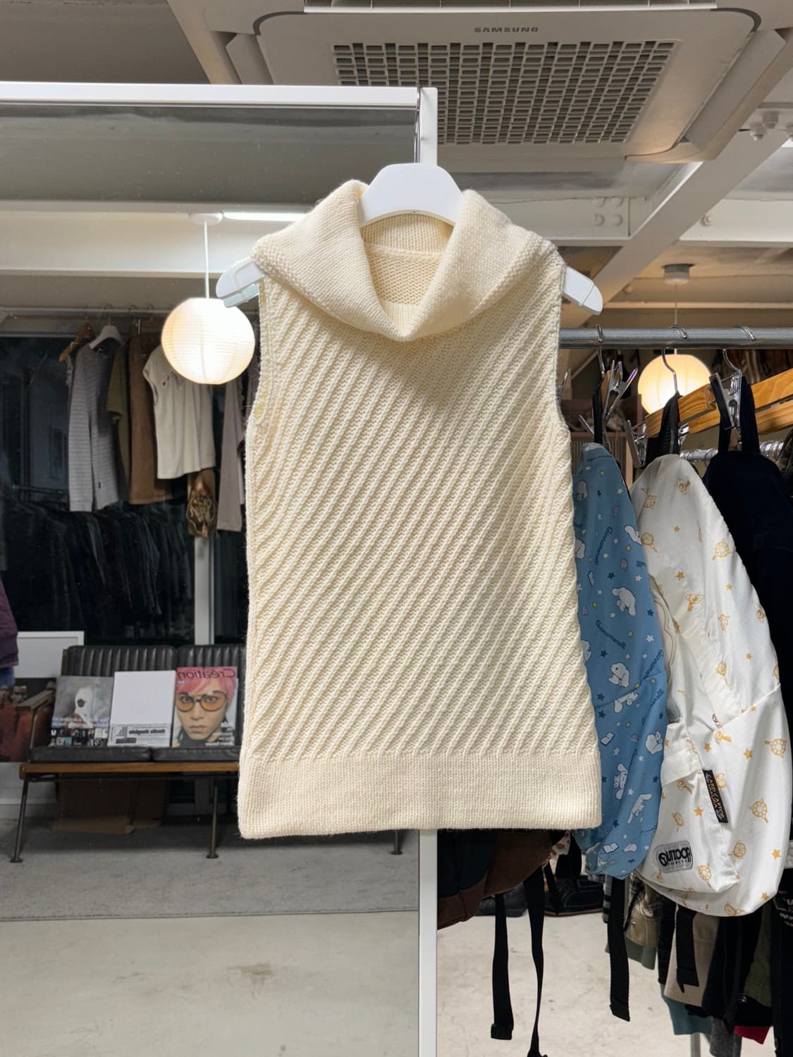 미쉘클랑 하이넥 슬리브리스 니트 상품이미지1