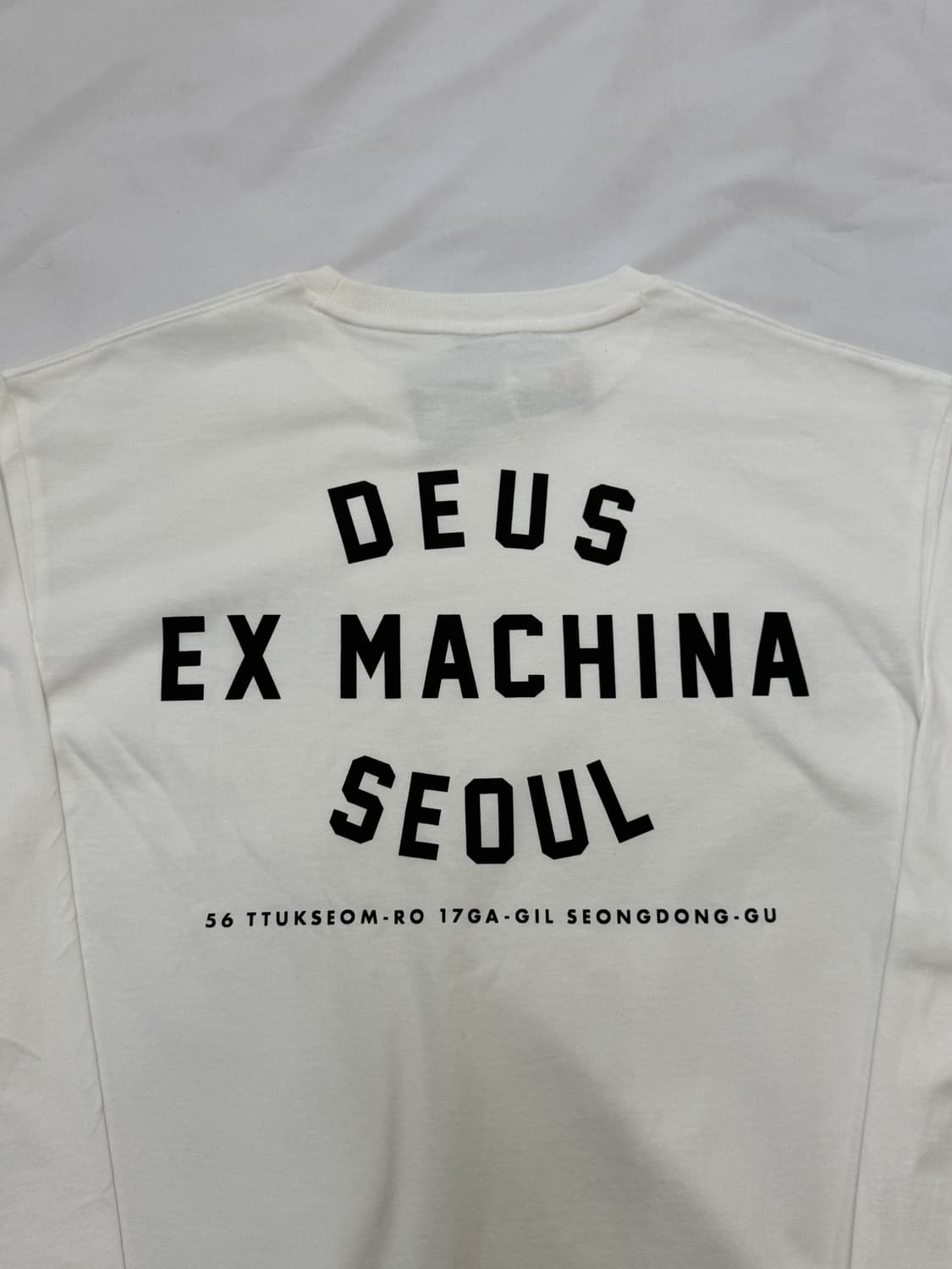 [새상품]Deus데우스 서울 컬리지 긴팔 롱슬리브 티셔츠 흰색 새상품 L 상품이미지1