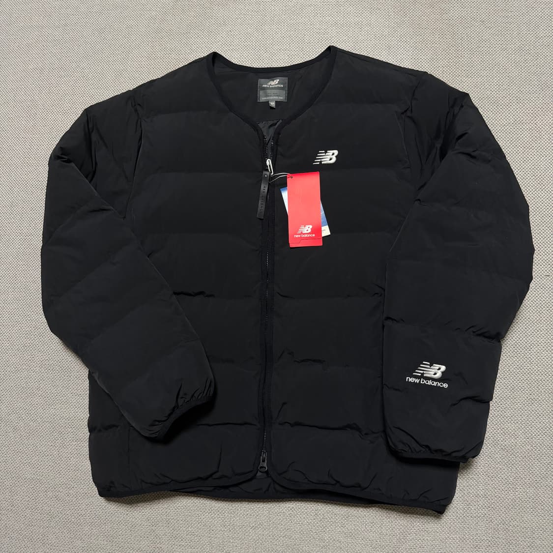 뉴발란스 라운드 경량패딩 상품이미지1