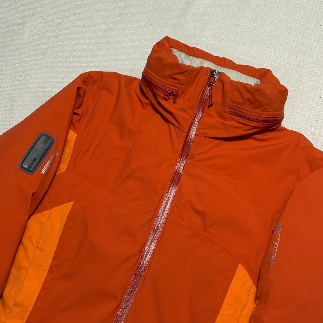 M 아크테릭스 여성용 윈드스토퍼 내장후드 오렌지 아톰 자켓 상품이미지1