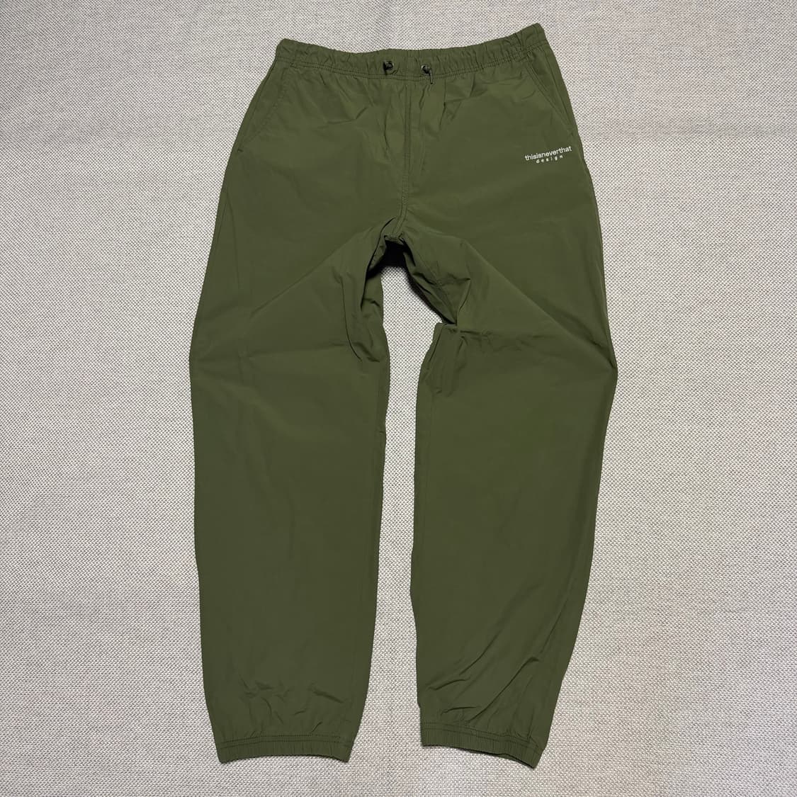 디스이즈네버댓 카키색 나일론 조거팬츠 상품이미지1