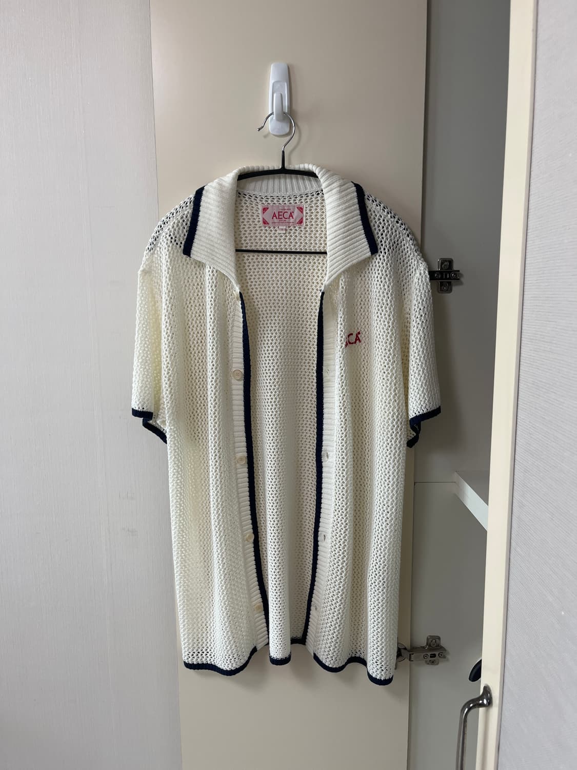 에이카화이트 펀칭 니트 가디건 상품이미지1