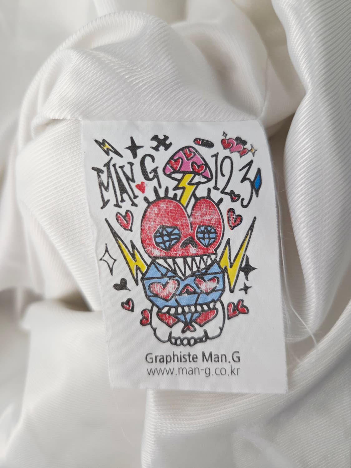 Graphiste Man.G (만지) 화이트 자수 그래픽 코치 자켓 상품이미지9