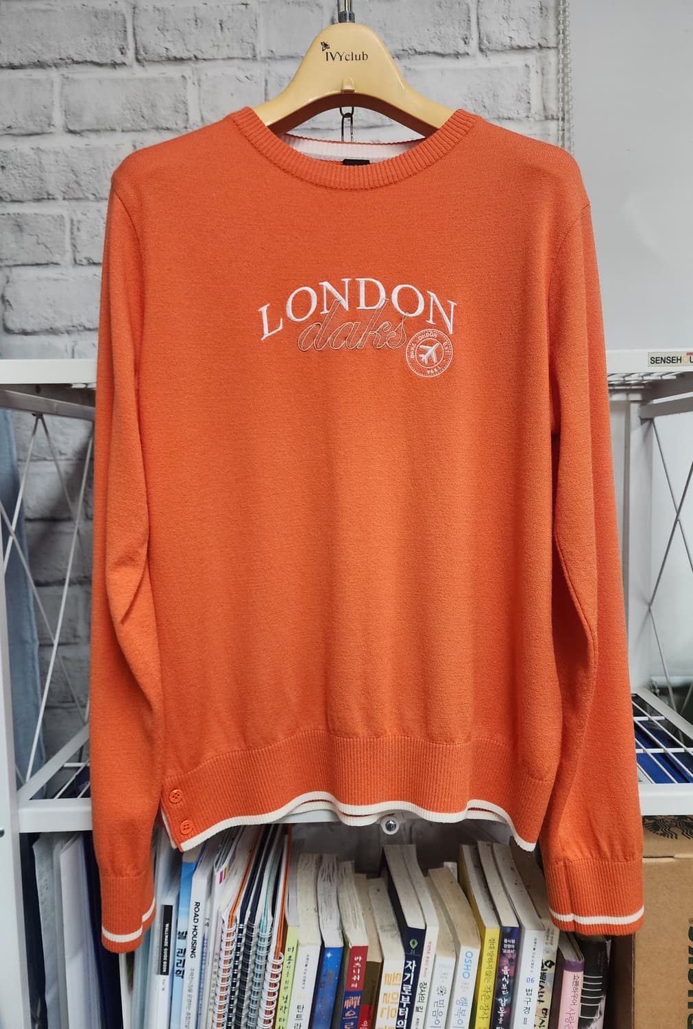 닥스 여성골프니트 99/66 라운드넥 레터 자수 MM07 상품이미지1