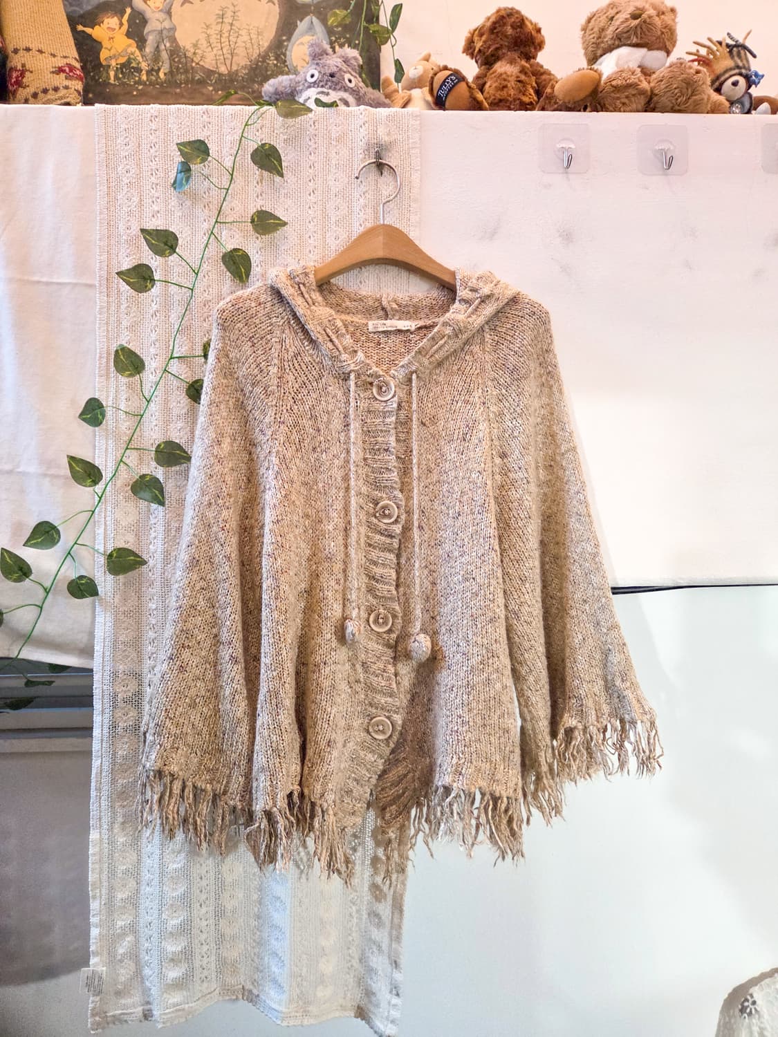 케이프핏 밑단 태슬 보카시 가디건 상품이미지1