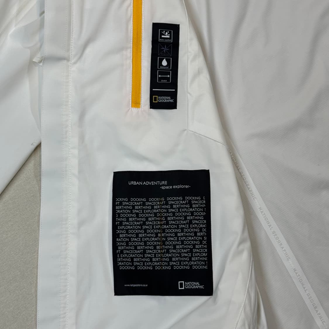 XL) 내셔널지오그래픽 화이트 바람막이 후드 자켓 미사용품 상품이미지7
