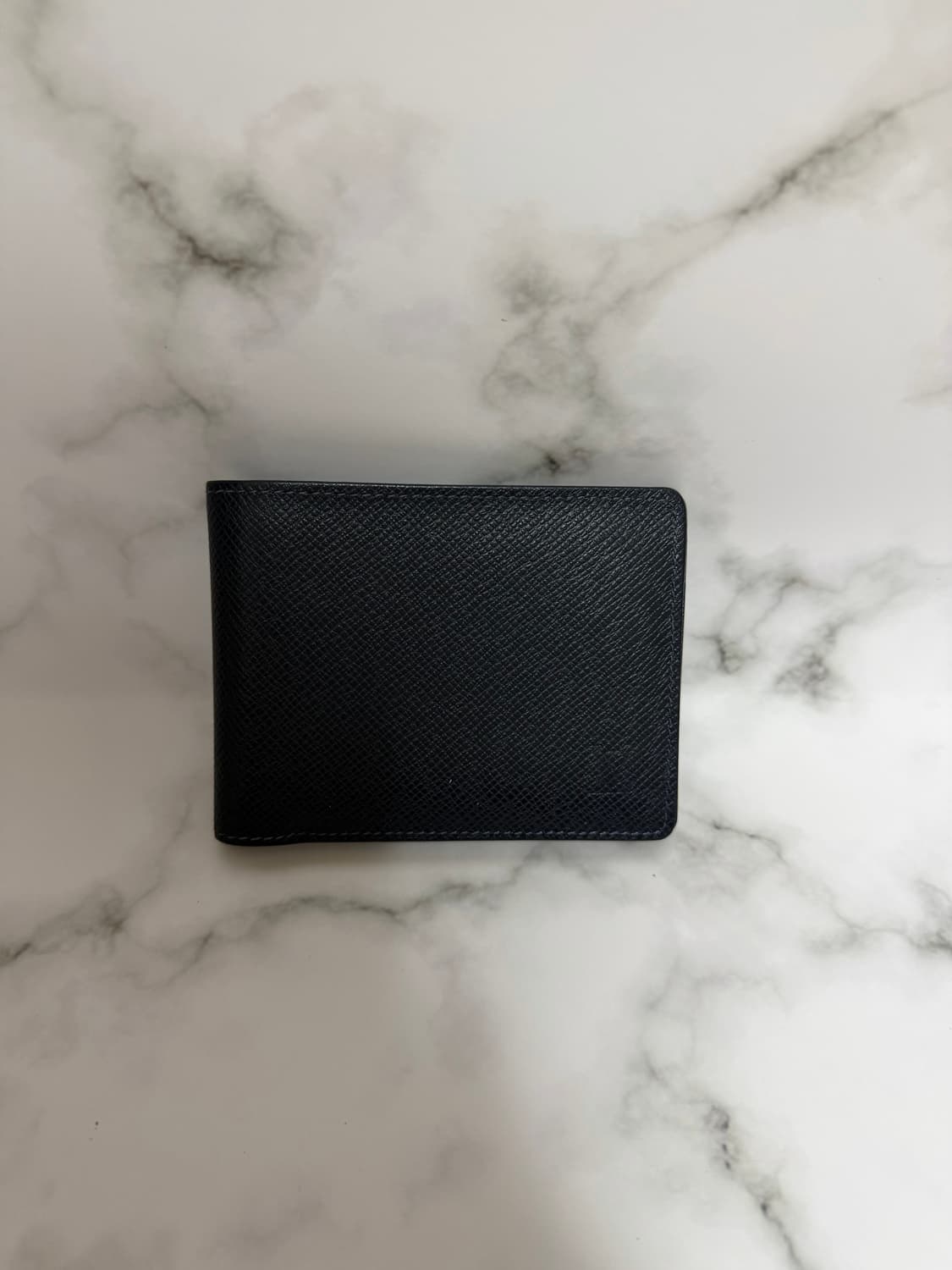 루이비통 멀티플 월릿 타이가 반지갑 상품이미지1