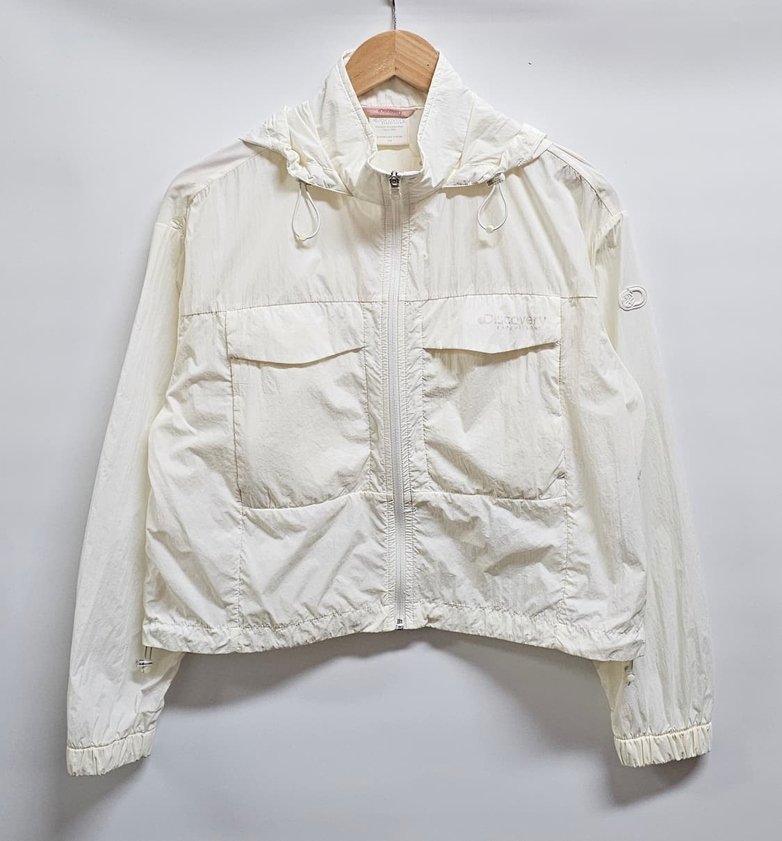 디스커버리 아이보리 후드 바람막이 자켓 90 상품이미지1
