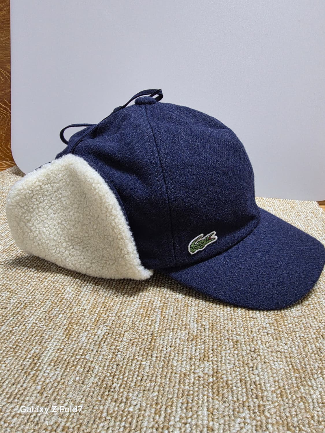 라코스테 울 솔리드 트래퍼 귀달이 모자 상품이미지1