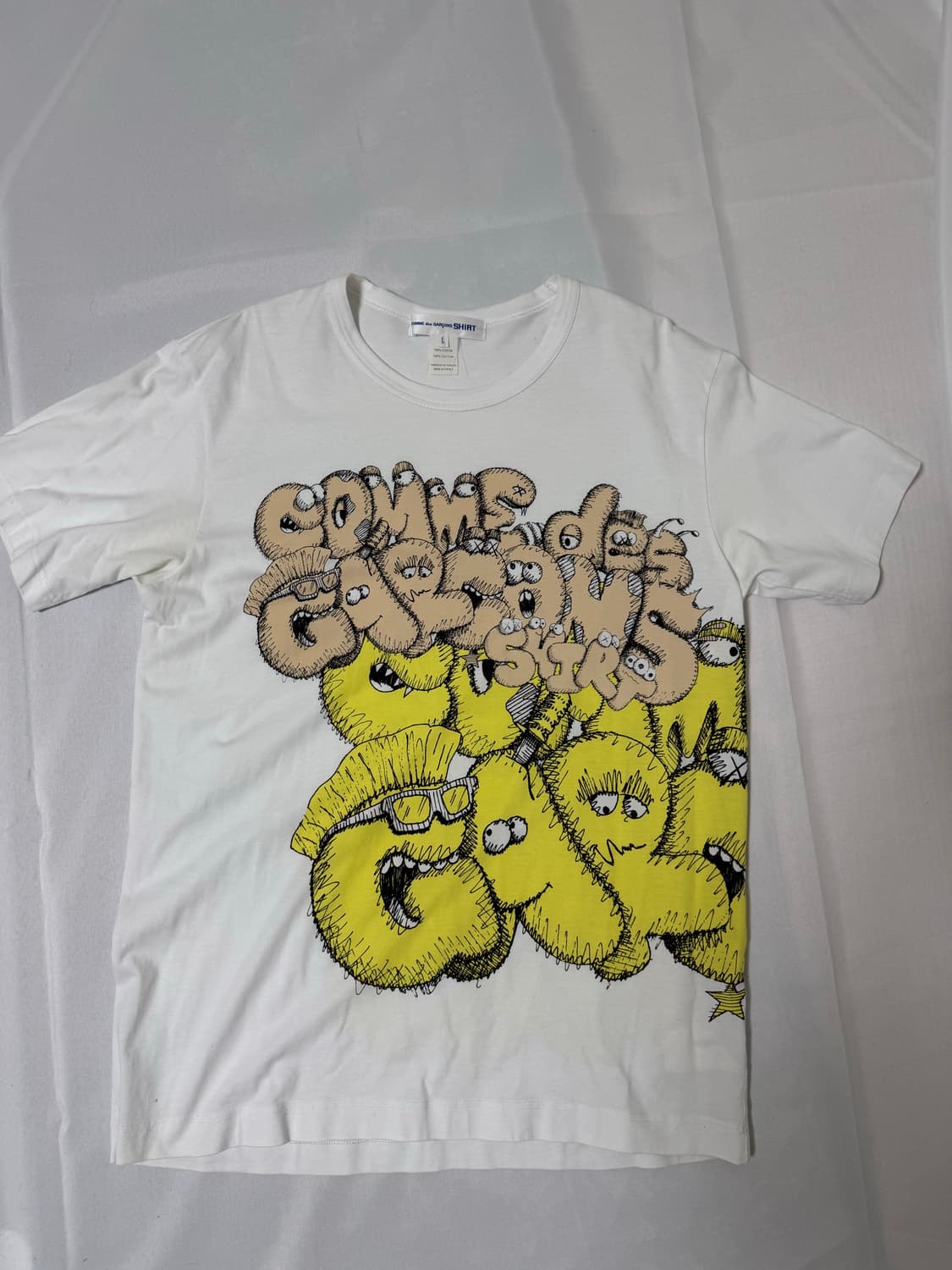 꼼데가르송 셔츠 X 카우스 콜라보 티셔츠 상품이미지1