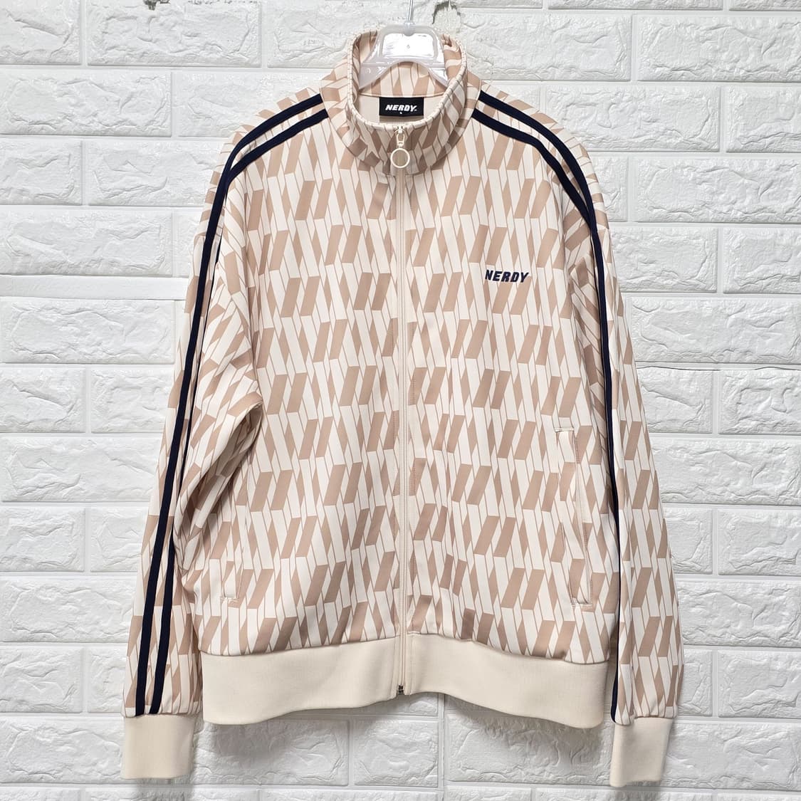 택포// 널디 심볼 패턴 트랙탑 L 크림 상품이미지1