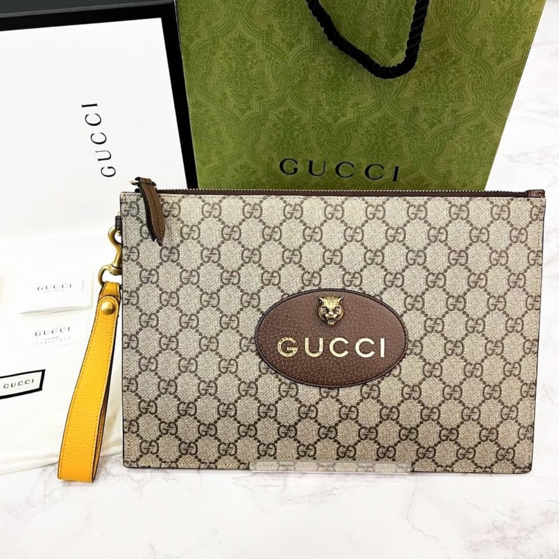 구찌 네오 빈티지 GG 수프림 클러치 상품이미지1